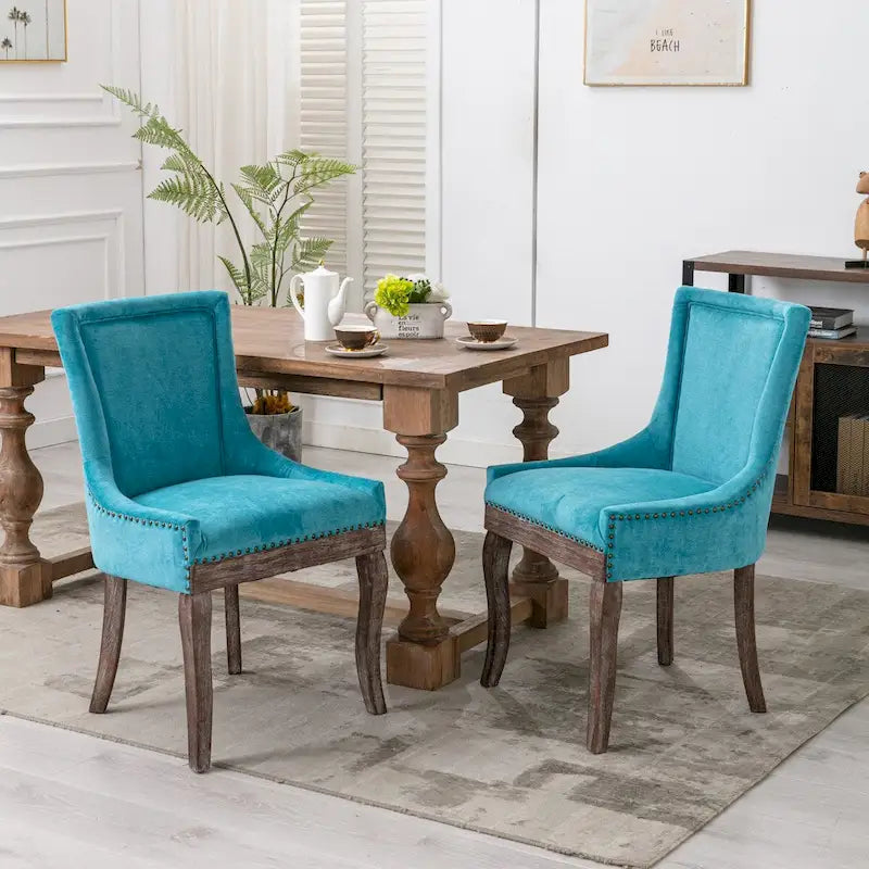 Ultra Side Dining ChairThickened fabric chairs with neutrally toned solid wood legs Bronze nail headSet of 2Blue